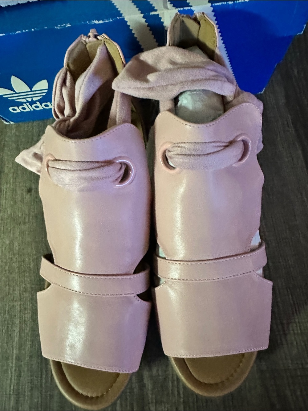 Pink Women's Sandals with zip up heel and bow.